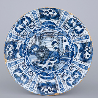 A good Dutch Delft blue and white chinoiserie dish with a lion, 17/18th C.